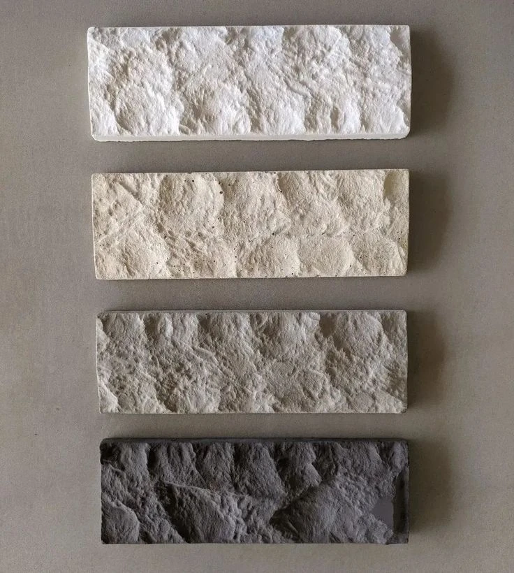 Quatro placas Rockface lado a lado, do branco ao grafite